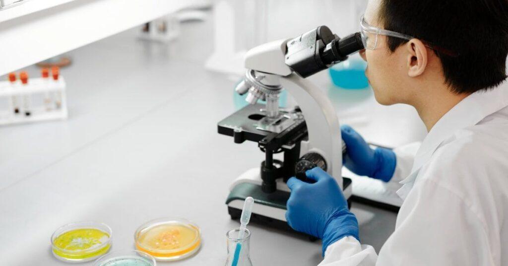 scientist working in biotech cleanroom scientist working in biotech cleanroom