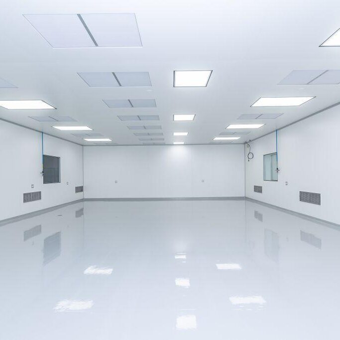 Factory-fabricated modular cleanroom walls installed in a pharmaceutical packaging area