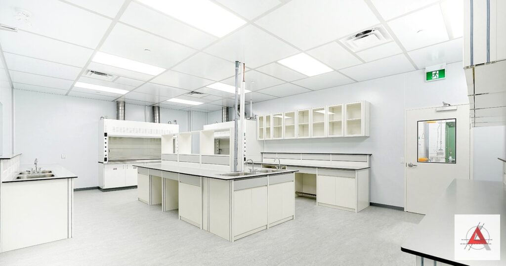 Flush-frame cleanroom door with vision panel separating controlled zones