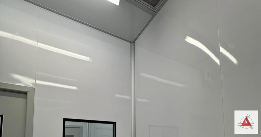 Smooth, sealed modular cleanroom wall panels with integrated vision panel