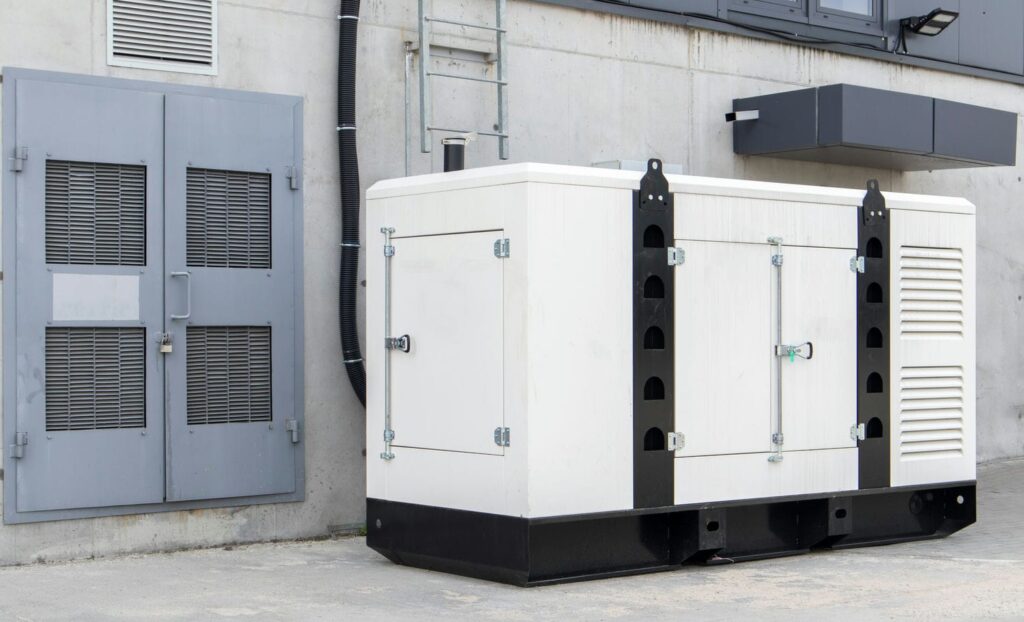 Industrial backup generator outside a cleanroom facility representing power continuity planning for hurricane season
